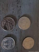 Four state quarters showing various reverse designs