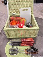 Overall view of basket contents and knives, egg beater, beater attachment