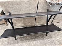 Front view showing both shelves and mounting brackets