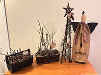 Group shot of all four rustic lighted Christmas decorations