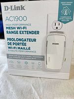 Front of sealed retail box showing D-Link DAP-1950 AC1900 Mesh Wi-Fi Range Extender