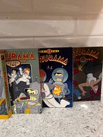 Front view of four Futurama DVD volumes