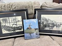 Lot overview showing two framed photographs and book
