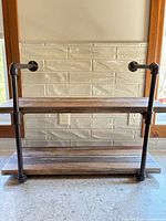 Front view of entire two-tier wall shelf