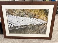 Full view of framed photograph showing image, mat and frame