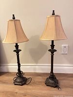 Front view both bronze lamps with shades showing overall design and size