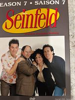 Front cover of Seinfeld Season 7 DVD box with bilingual English/French text