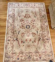 Full view of rectangular wool rug showing overall pattern and colors