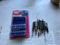 Front view of sealed Skil 33-piece bit set with loose bit holders