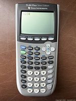 Front view of TI-84 Plus Silver Edition graphing calculator, display powered on