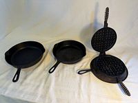 Overall view of two skillets and waffle iron