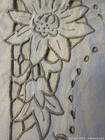 Close-up of cutwork floral embroidery and edging