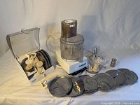 Full lot: motor base, work bowl, disc holder, loose discs and attachments