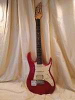 Full front view of red Ibanez RX40 guitar