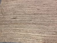 Full view of large braided jute rug