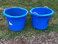 Front view of both blue tubs showing shape, color and exterior condition