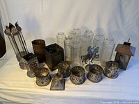 Group view of all candle holders, glass candles and tin figures