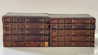 All ten volumes stacked horizontally showing spines I–X