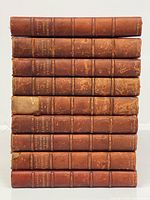 Front view stacked spines showing titles and wear