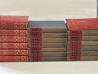 Stacks of both book series showing bindings and color difference