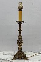 Full view of ornate brass candlestick lamp