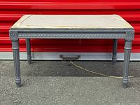 full view of grey carved wooden vanity bench frame missing seat