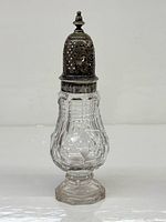 Full view of sugar shaker showing sterling lid and crystal body