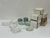 group shot of all bobeches, adhesive tins and boxes