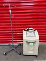 Oxygen concentrator and IV pole together