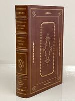 Front and spine view showing leather binding, gilt decoration, title and publisher
