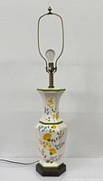 Full view showing entire lamp with harp, finial and bulb