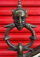 Devil head figural finial in brass