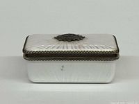 Front view of Evans guilloche cigarette box