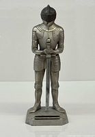 Front view of cast metal knight lighter