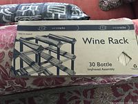 Front of sealed box showing product name and 30-bottle capacity