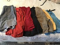 All seven swim trunks laid out to show colors and quantity