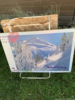 Front view showing entire mounted poster with alpine scene