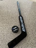 Stick and puck full view on countertop