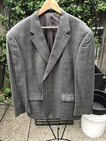 Front view of grey micro-houndstooth Chaps blazer on hanger