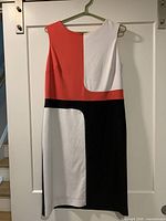 Front view of sleeveless Evan-Picone dress showing red, white, black colorblock pattern