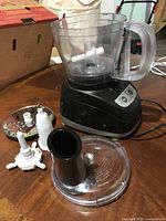 Overall view of food processor base, bowl, lid, blades and disc
