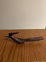 side profile of wooden bird figurine