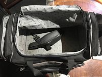 Interior view showing patterned lining and shoulder strap