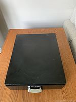 Top view of Keurig black metal pod holder showing surface wear