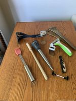 All utensils laid out on wooden surface