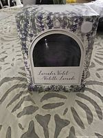Front of boxed Lavender Violet scented candle, showing label