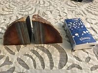 Pair of agate paperweights beside tissue pack for scale