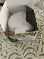Sealed white diffuser inside opened retail box