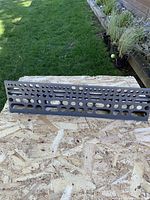 Front view showing full rectangular panel with varied hole pattern