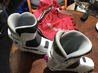 Pair of Raichle RX 579 ski boots and North Country bag top view